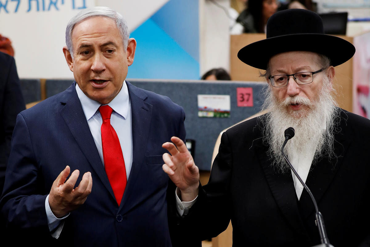 sraeli PM Benjamin Netanyahu and Health Minister Yaakov Litzman gesture as they deliver statements during a visit to the Health Ministry national hotline. Reuters/File