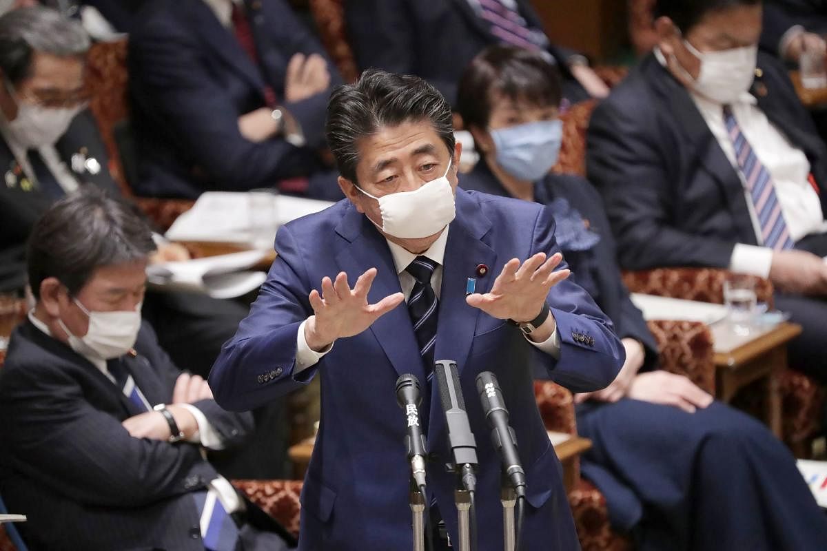  Japan's Prime Minister Shinzo Abe, wearing a face mask amid concerns over the spread of coronavirus. (AFP Photo)