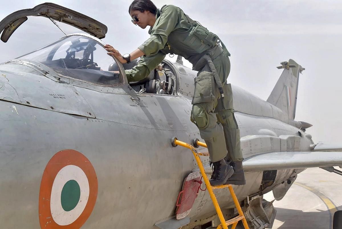 Flt Lt Bhawana Kanth enters her aircraft as she completes Day operational syllabus on MiG-21 Bison aircraft. She is the first women fighter pilot to be qualified to undertake missions by day on a fighter aircraft. PTI photo