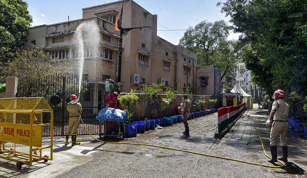 Firefighters spray disinfectants at a locality near Nizamuddin mosque during a nationwide lockdown in the wake of coronavirus pandemic, in New Delhi, Thursday, April 2, 2020. (Credit: PTI Photo)