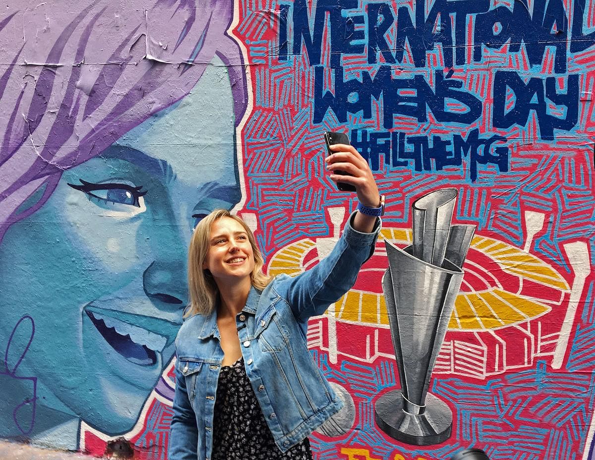 Australia all-rounder Ellyse Perry, the ICC Women's Cricketer of the Year, poses for a selfie in front of a mural promoting the WomenÕs T20 World Cup tournament in Melbourne. Reuters/File