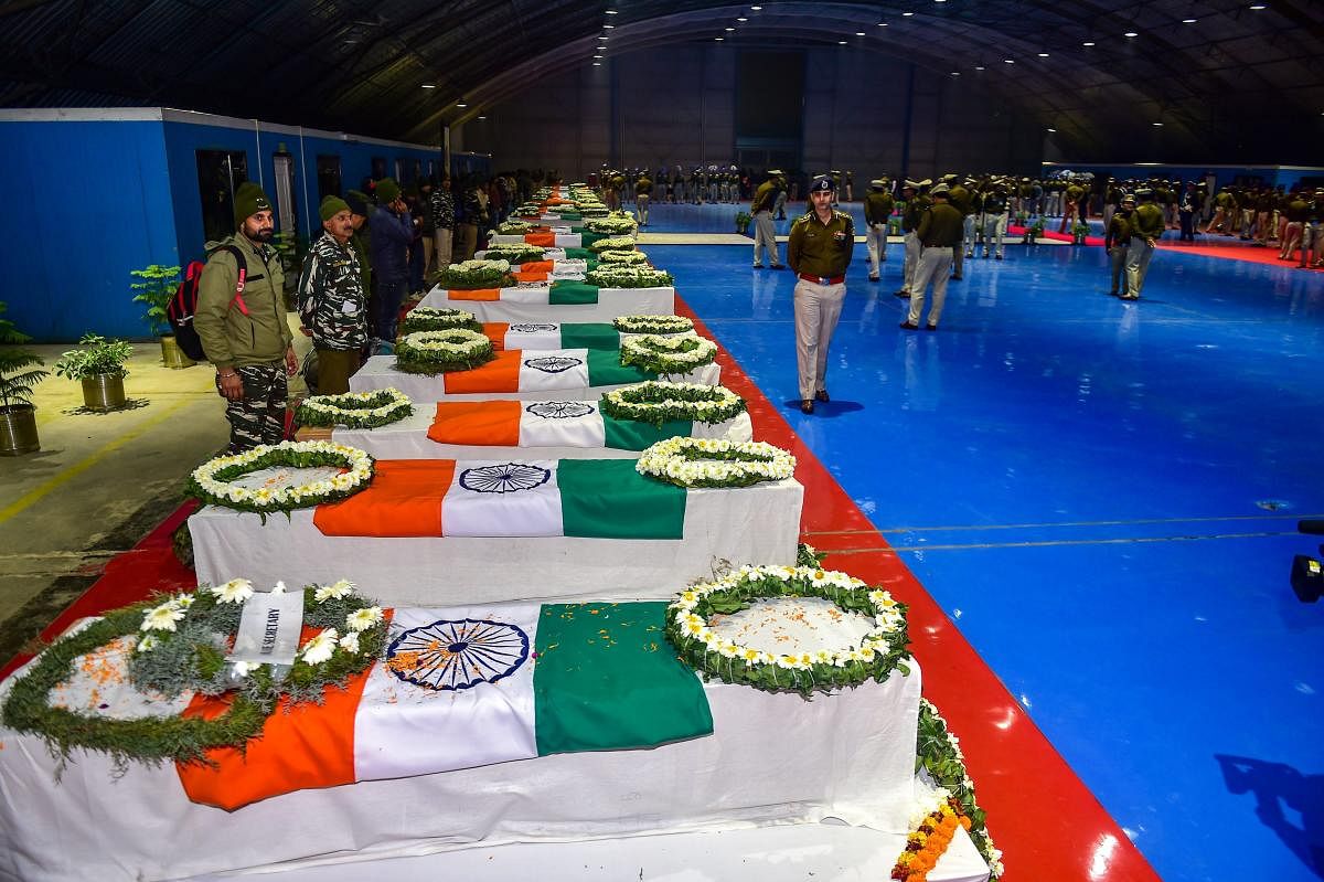 Mortal remains of CRPF jawans, who lost their lives in the Pulwama terror attack, during a tribute paying ceremony at AFS Palam in New Delhi. (PTI Photo)