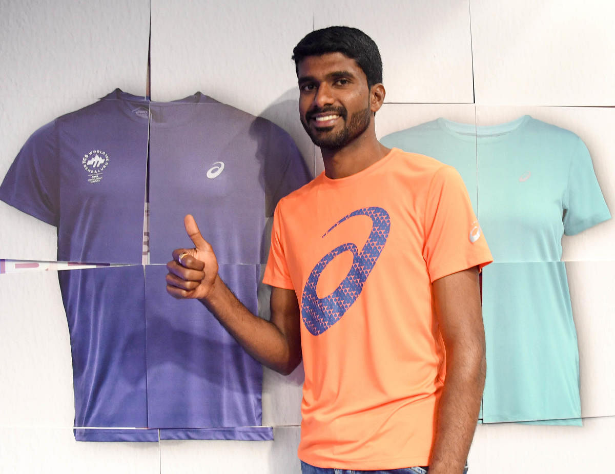 Jinson Johnson during the unveiling the Finisher Day T-Shirt in Bengaluru on Tuesday. DH Photo/ B H Shivakumar