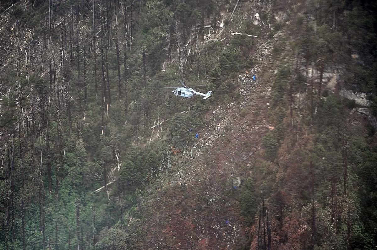 This handout photo released by the Indian Air Force (IAF) on June 14, 2019 shows an Advanced Light Helicopter (ALH) at the crash site of the IAF AN-32 aircraft, about 16 km north of Lipo in Arunachal Pradesh. (IAF/AFP)