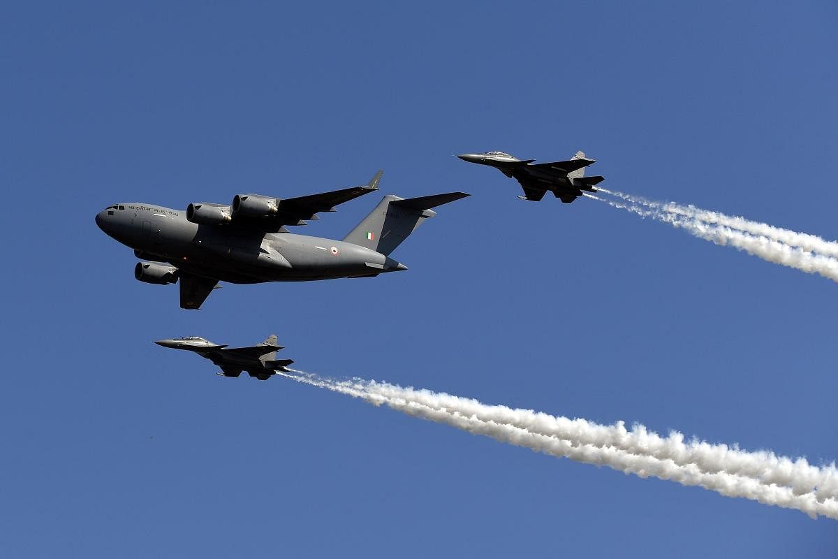 An Indian Air Force (IAF) cargo aircraft C-17 Globemaster (front) and Sukhoi fighter jets (back L and R) fly past during the Air Force Day parade at an IAF station in Ghaziabad, on the outskirts of New Delhi, on October 8, 2019. (AFP Photo)