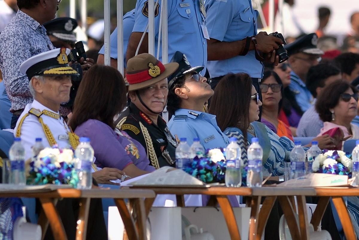 Navy Chief Admiral Karambir Singh, Army Chief Gen Bipin Rawat, cricket legend and honorary Group Captain Sachin Tendulkar and other dignitaries attend the 87th Indian Air Force Day Parade, at Hindon airbase, in Ghaziabad, Tuesday, Oct. 8, 2019. (PTI Photo