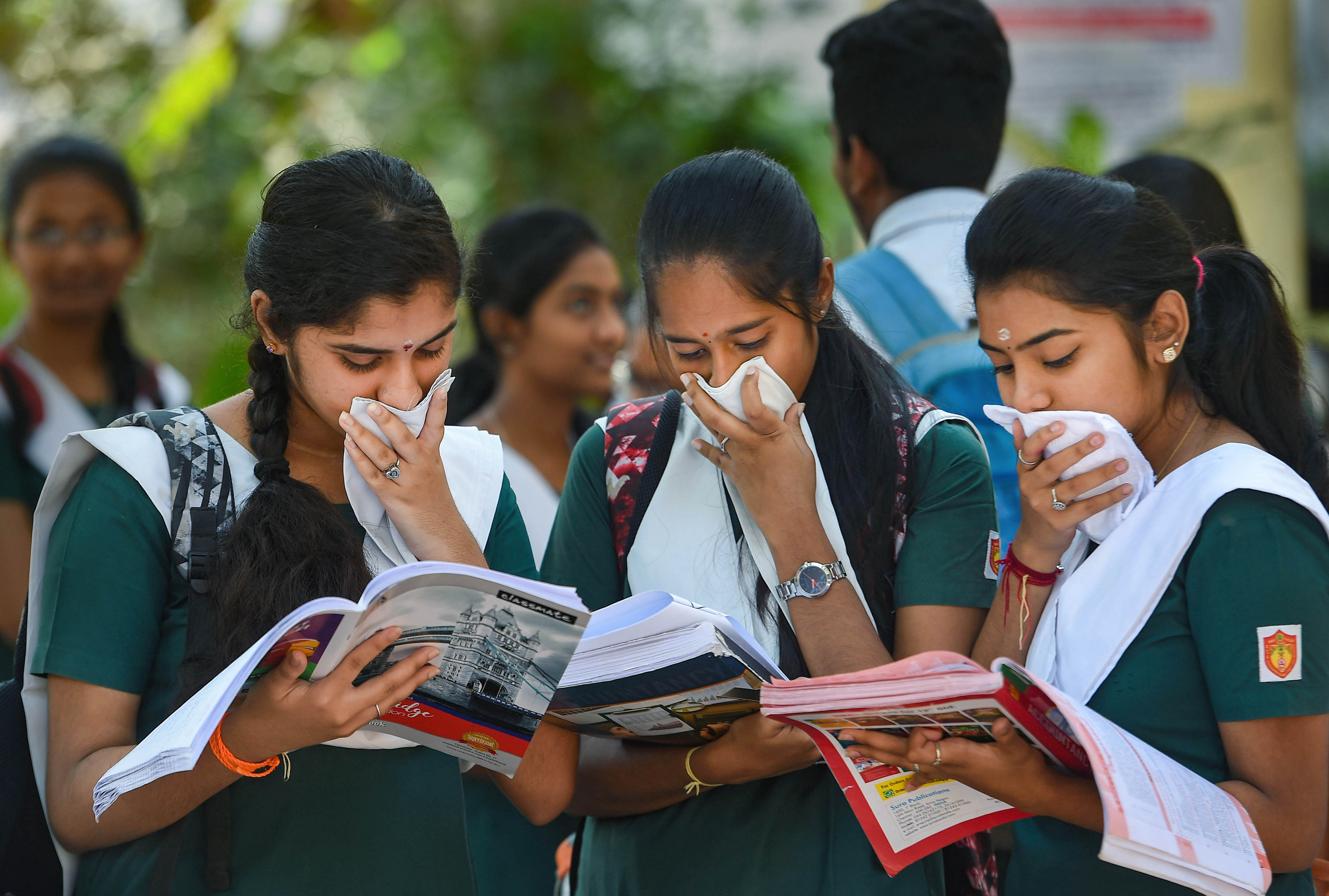 Chennai: Class 12 students, cover their faces to protect themselves from COVID-19. (Credit: PTI)