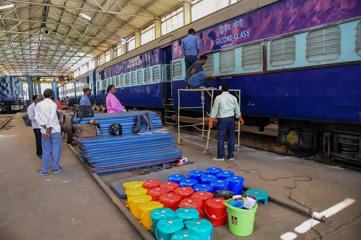 Railway technicians modify a train coach into an isolation ward for the treatment of COVID-19 affected patients at Rajendra Nagar terminal in Patna. PTI