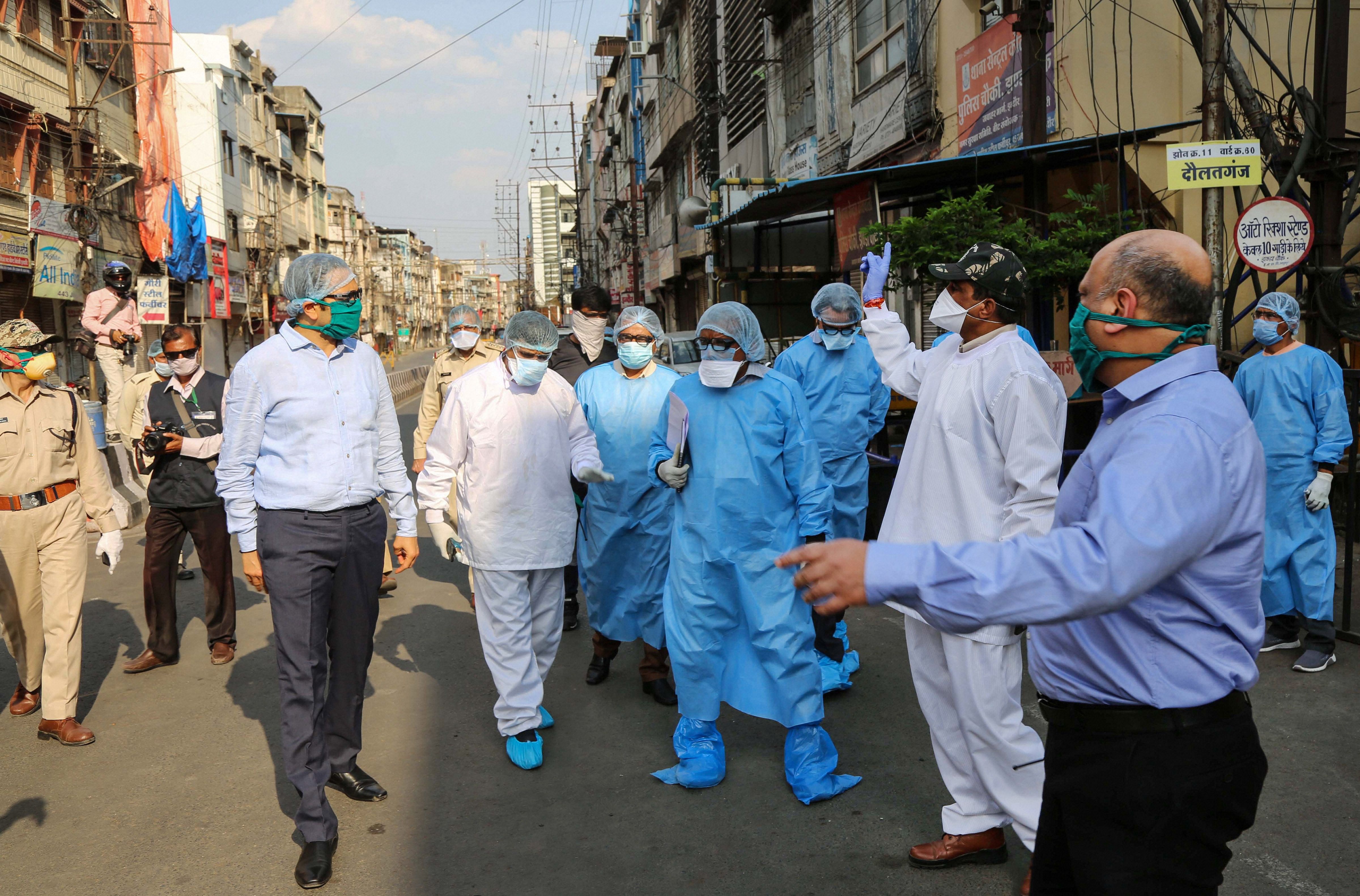 Indore divisional commissioner Akash Tripathi along with senior officials inspects Taat Patti Bakhal area where health workers were attacked by some locals who went there to screen residents in wake of COVID 19 pandemic, in Indore. (PTI Photo)
