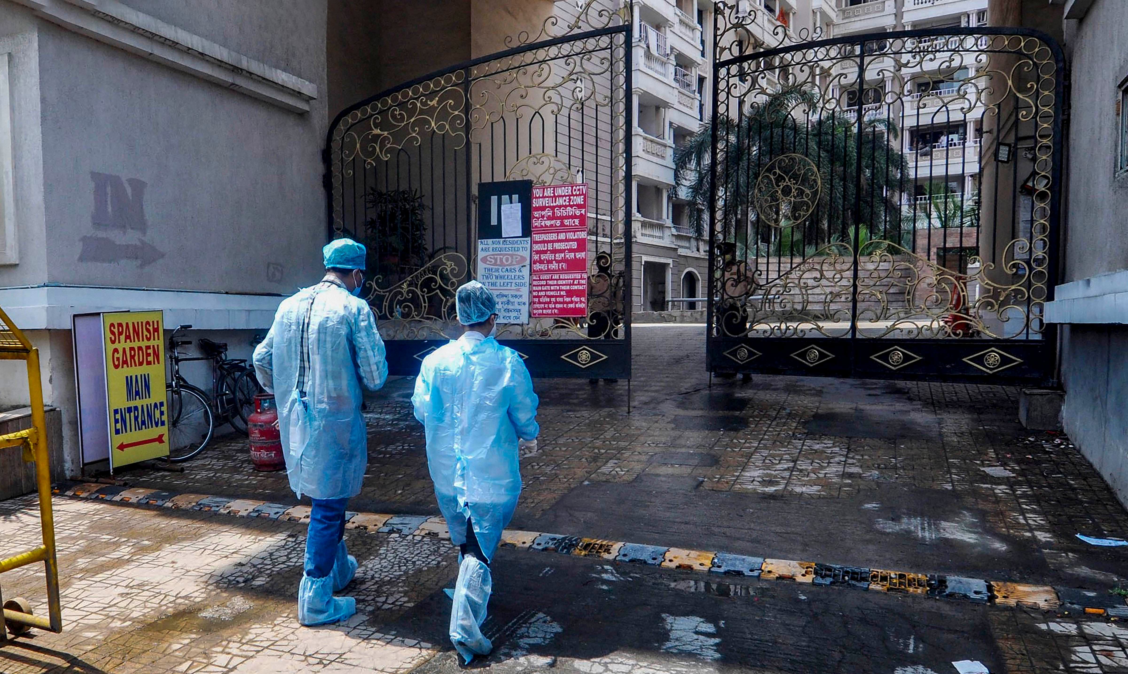 Medics arrive to take blood samples of residents of Spanish Garden residential complex after a COVID-19 positive case was detected in an apartment. (PTI Photo)