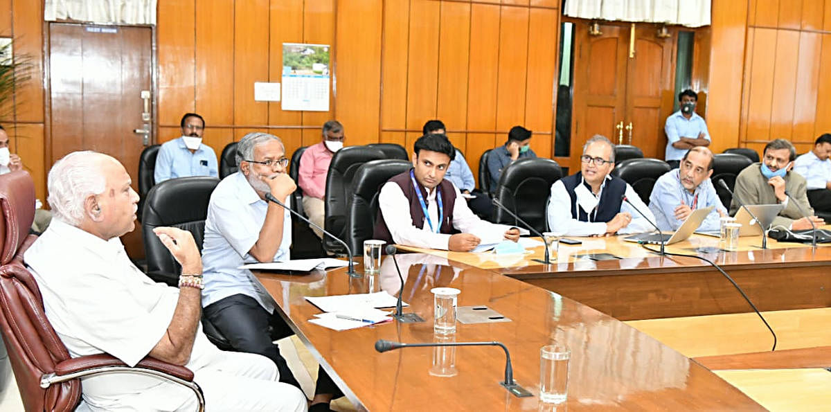 Chief Minister B S Yediyurappa at a meeting of the taskforce on Covid-19 in Bengaluru on Wednesday. Primary and Secondary Education Minister S SureshKumar, Medical Education Minister D K Sudhakar, Dr Devi Shetty and Dr C N Manjunath of the taskforce are s