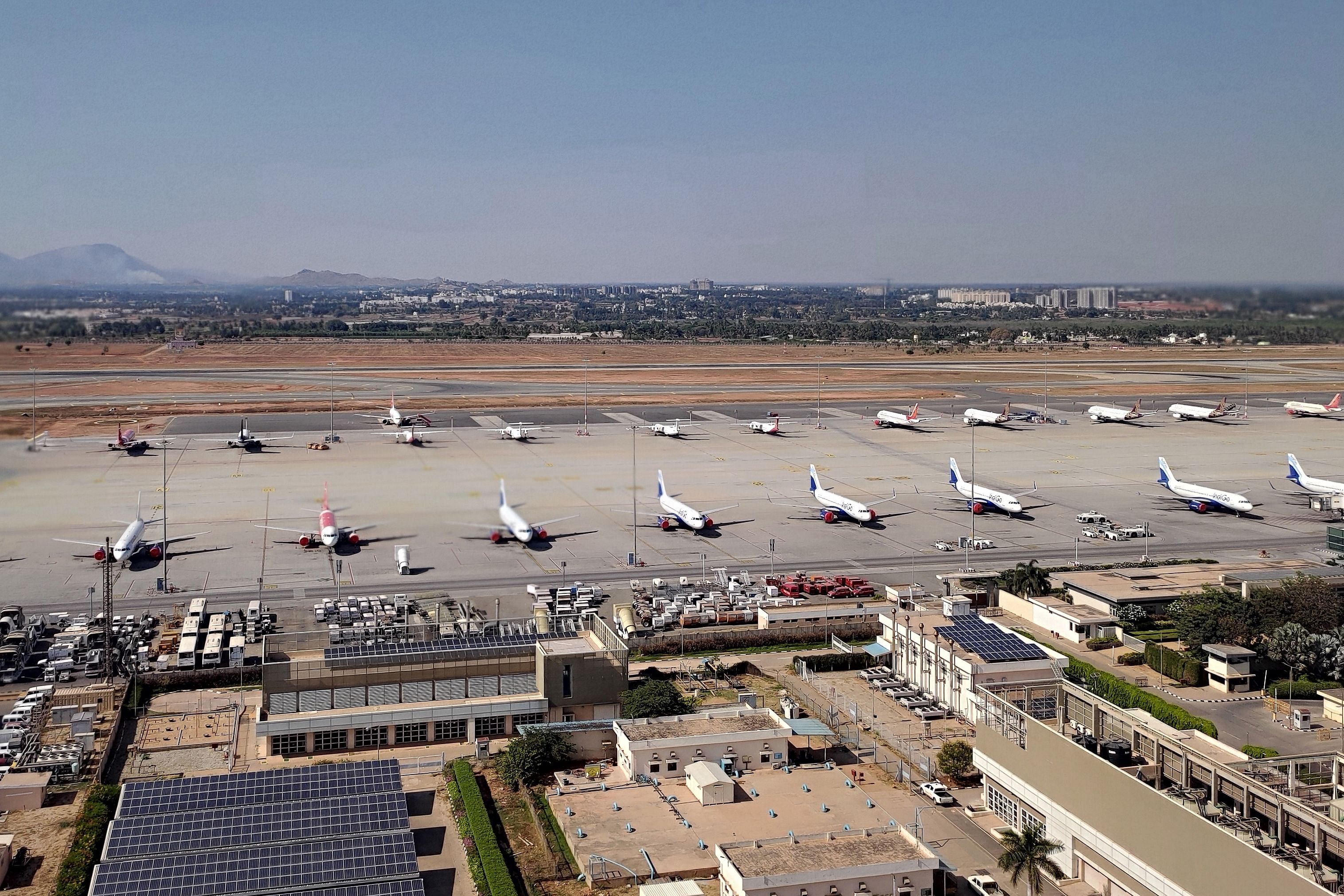 Planes at the apron of the Kempegowda International Airport Bengaluru during a government-imposed nationwide lockdown. (Credit: AFP)