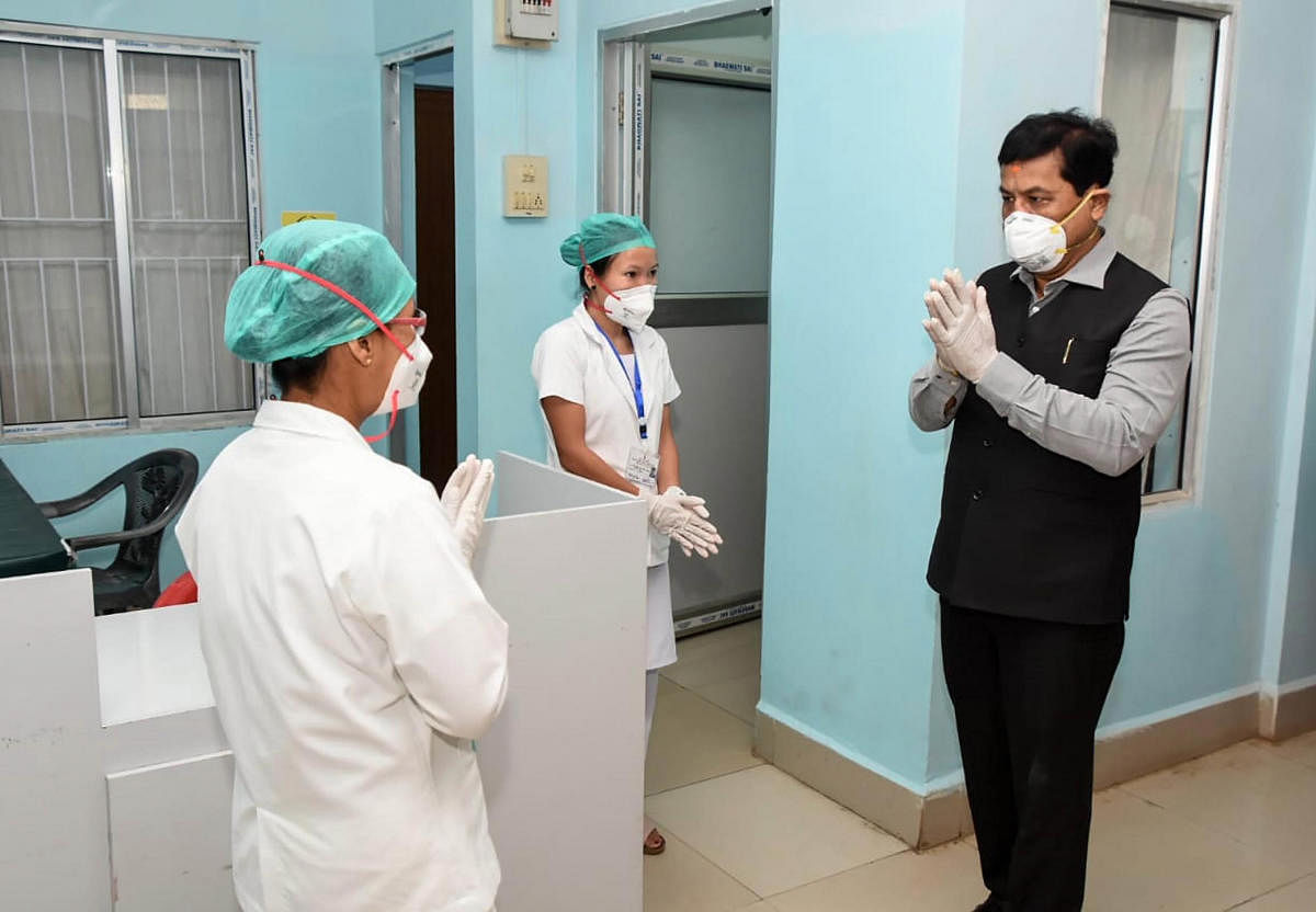 Assam Chief Minister Sarbananda Sonowal visits the Haflong Civil Hospital to review the preparedness against COVID-9. PTI