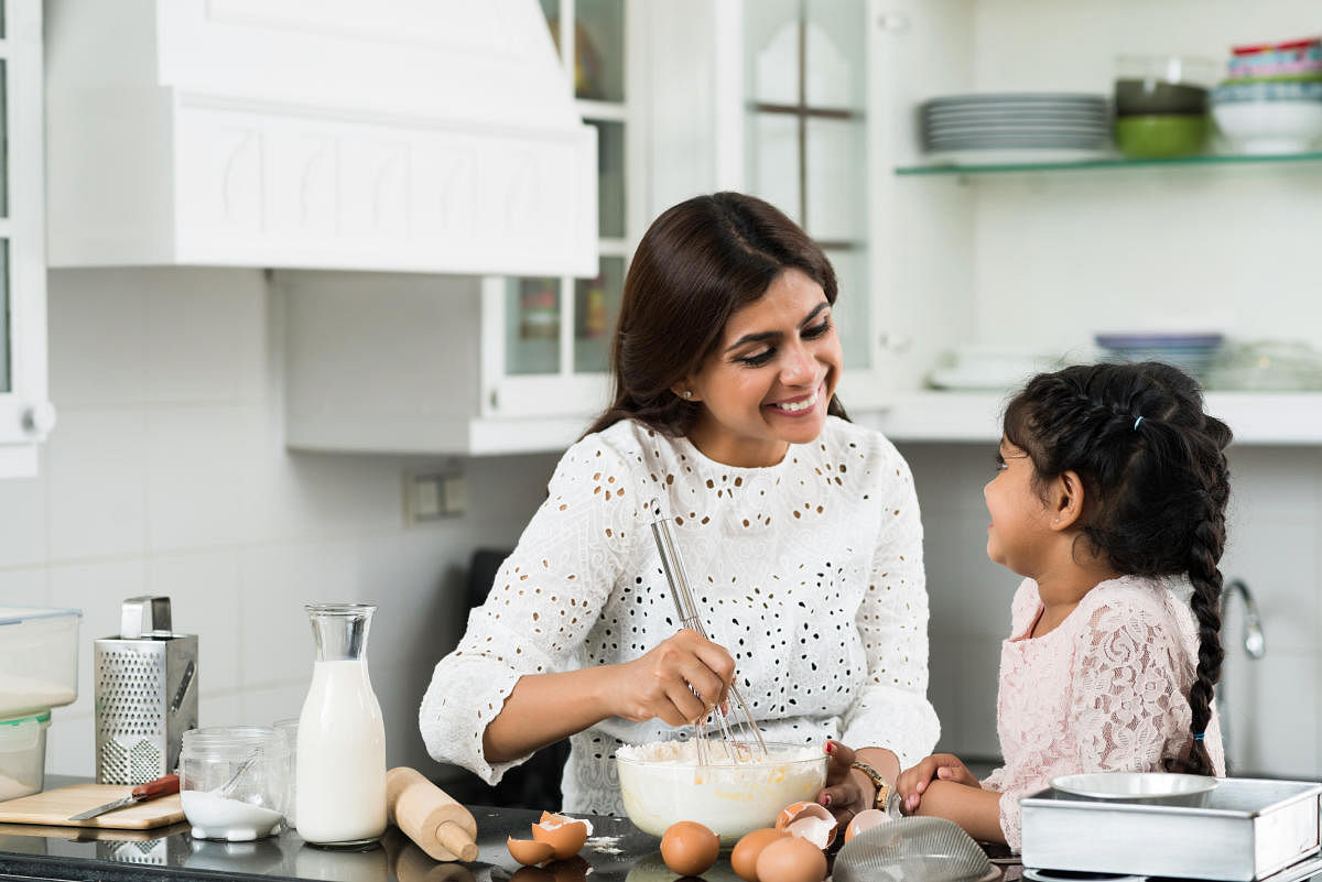 Use recipe apps to make child-friendly dishes and teach them to clean up after.