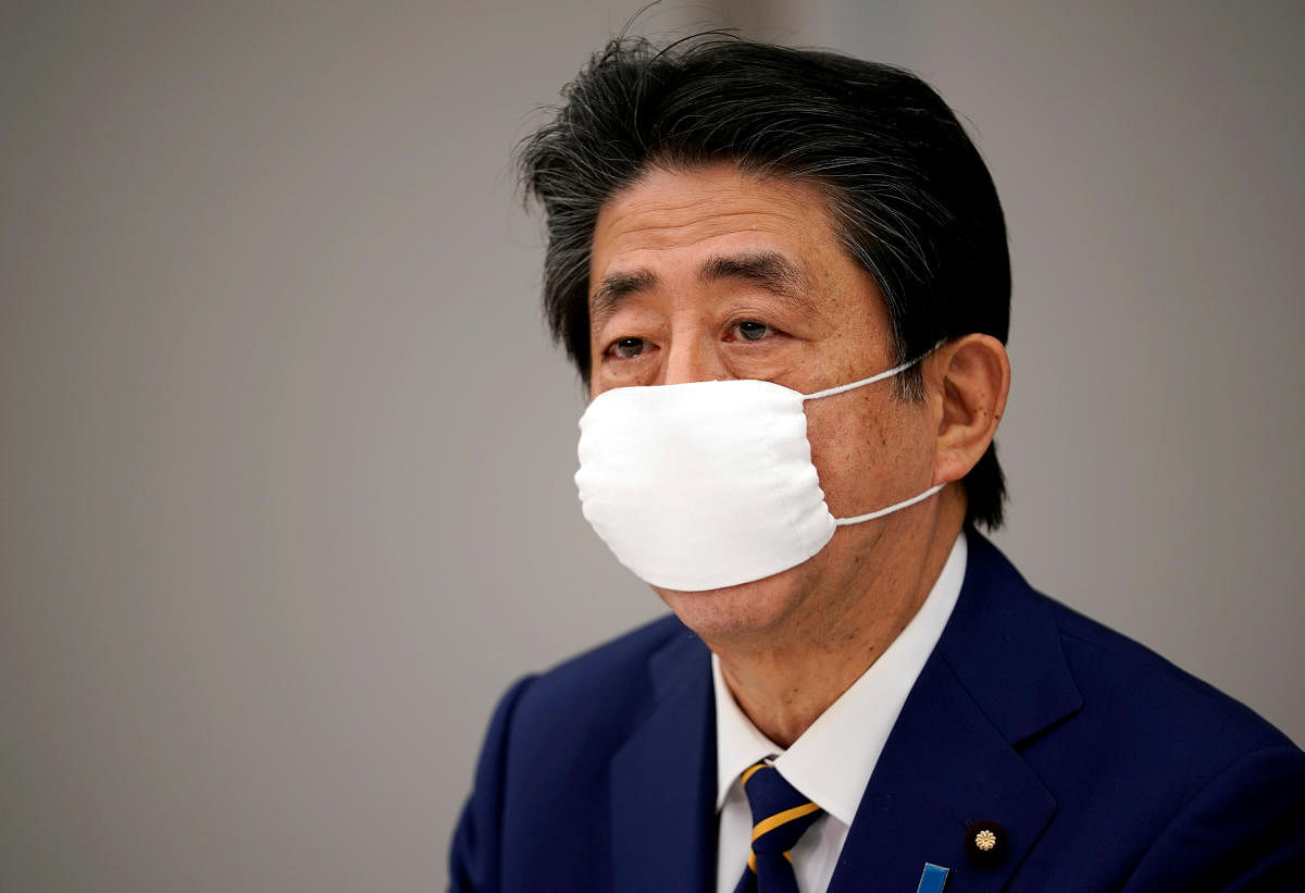 Japanese Prime Minister Shinzo Abe declares state of emergency during a meeting of the new coronavirus task force at the prime minister's official residence in Tokyo. Reuters