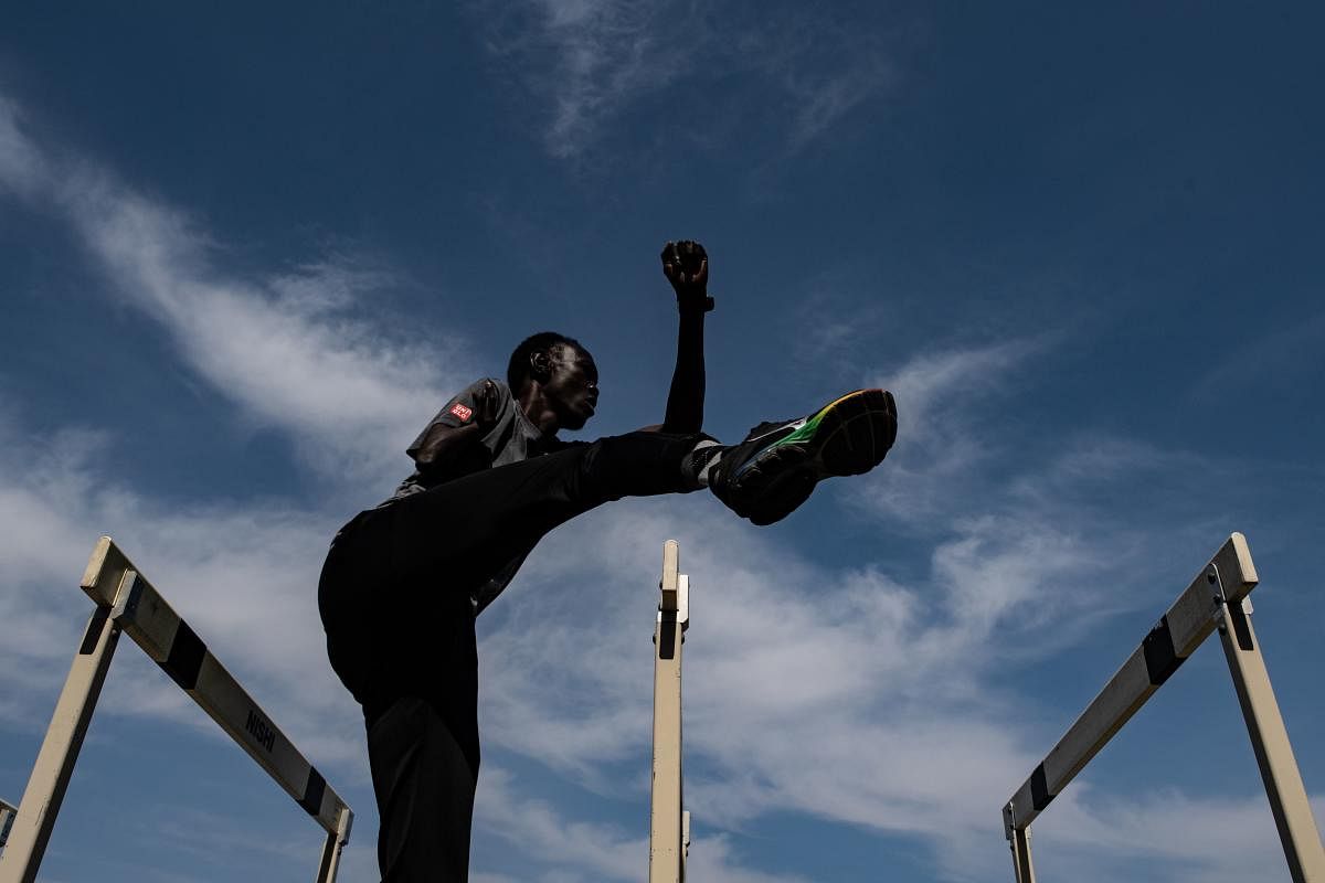 The postponement of the Tokyo 2020 Olympics was a heavy blow for many athletes, but a team of South Sudanese sprinters training in a Japanese town is hoping to turn the delay to their advantage. (Photo by AFP)