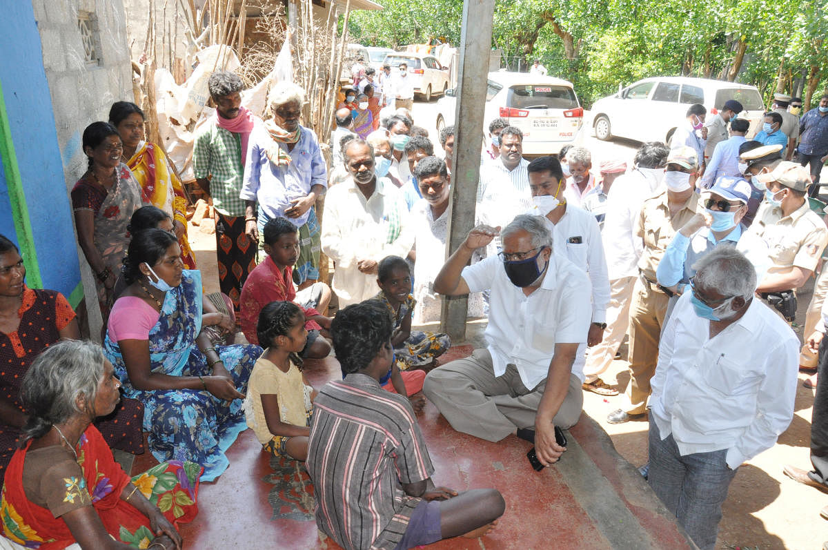 Minister S Suresh Kumar interacts with the Soligas at Kanneri Colony in Chamarajanagar taluk on Sunday. DH PHOTOS