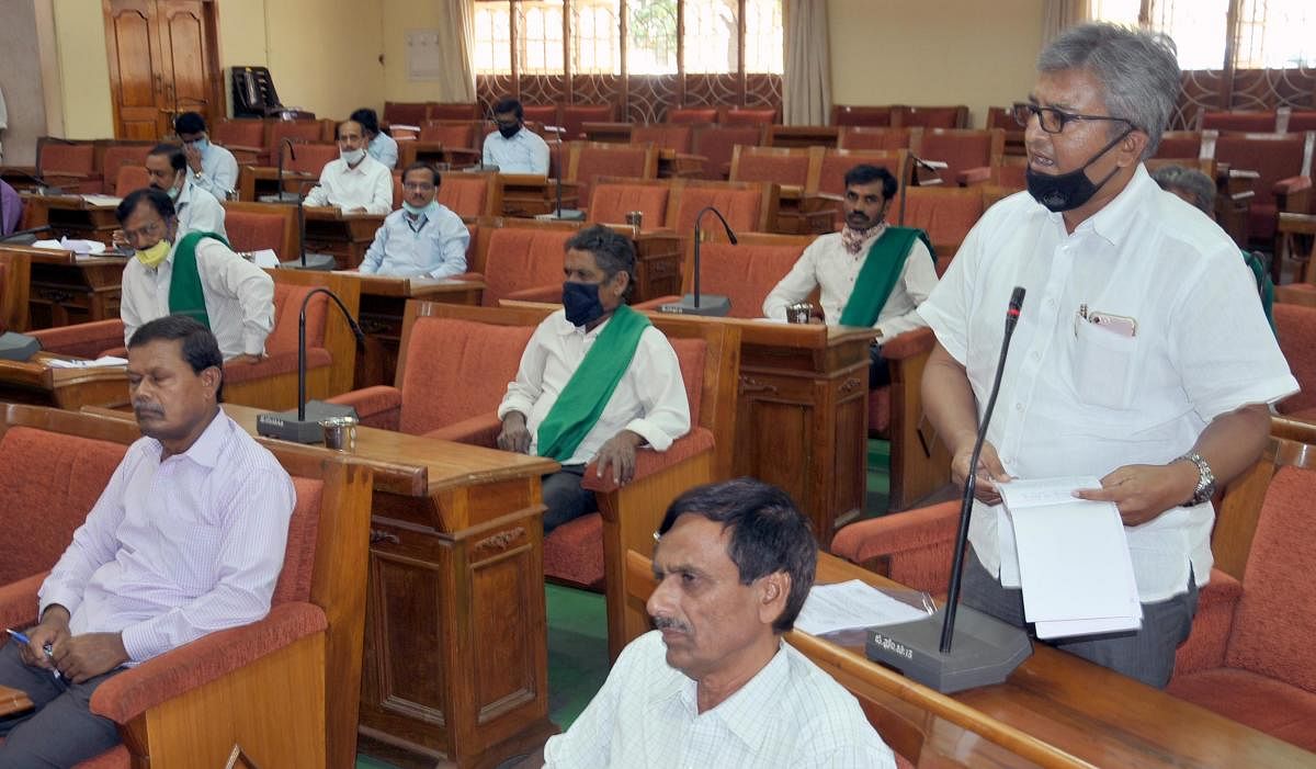 DCC President Dr K P Amshumanth speaks during a meeting in ZP hall in Chikkamagaluru.