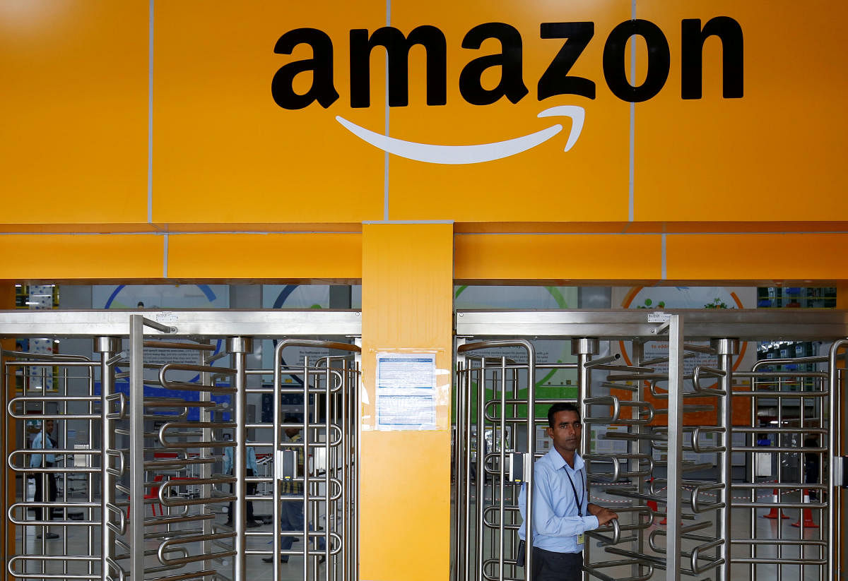 An employee of Amazon walks through a turnstile gate inside an Amazon Fulfillment Centre (BLR7) on the outskirts of Bengaluru. Credit: Reuters File Photo