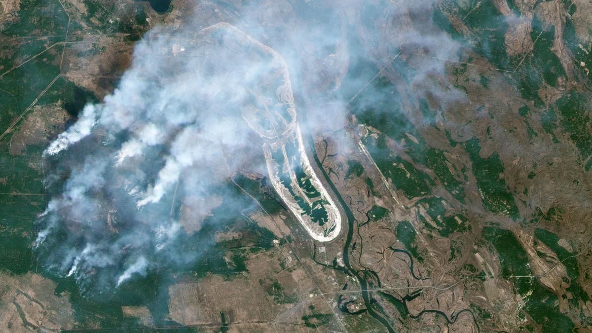 This handout satellite image taken on April 9, 2020 and released on April 15, 2020 by 2020 Planet Labs shows a forest fire burning in the Chernobyl exclusion zone in Ukraine, not far from the nuclear power plant.