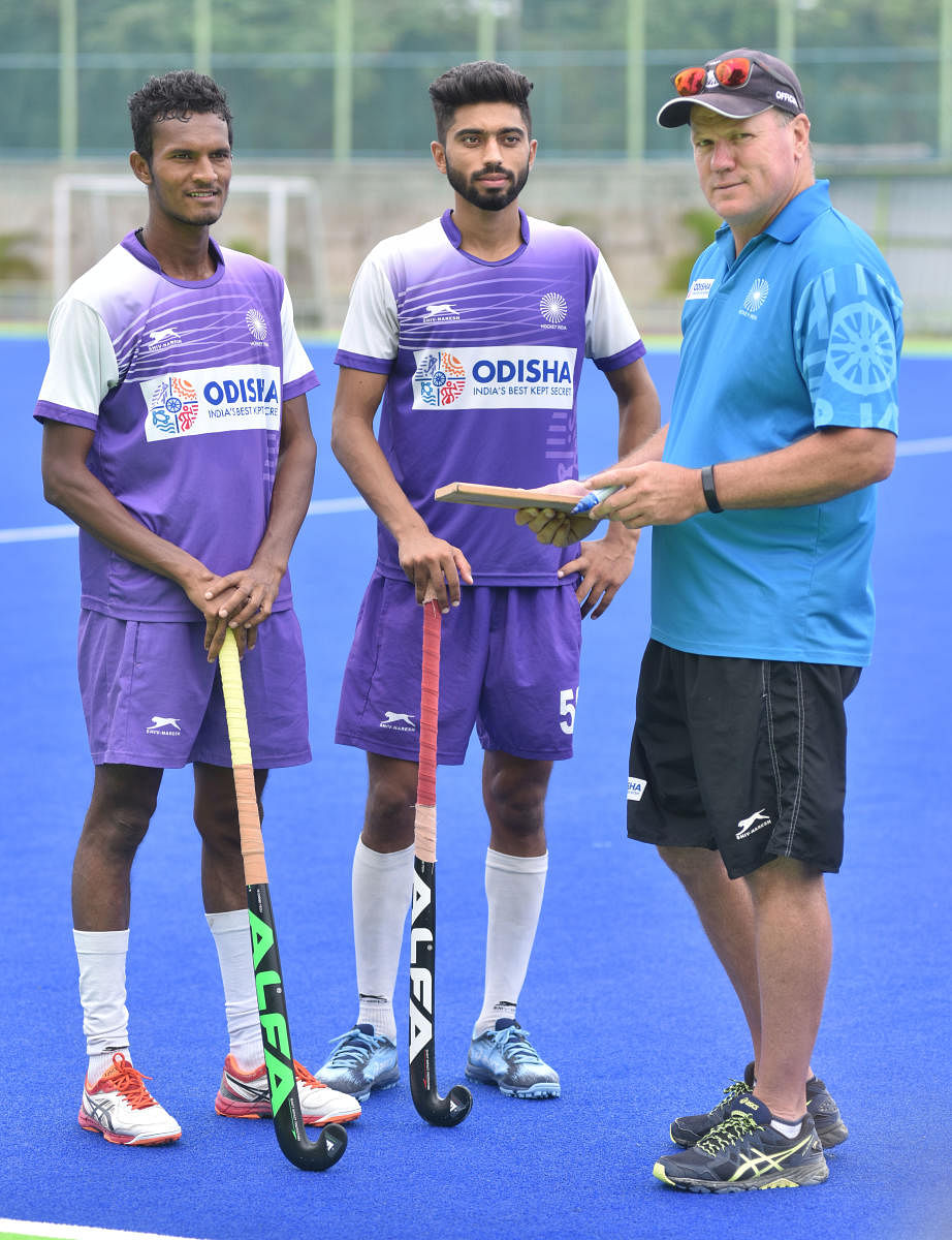 With no on-field training permitted, hockey coach Graham Reid (right) is using online classes to help the team stay in touch with the game. DH FILE PHOTO   