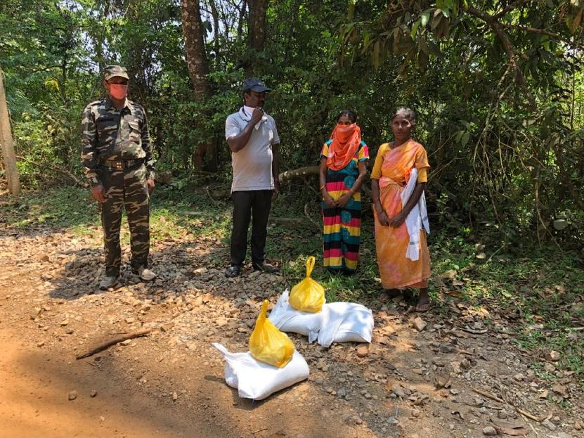 Bharathi (name changed - extreme right) at her house in Mujekan, Chikkamagaluru district.