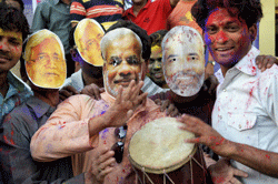 Patna: BJP youth activists wearing masks of Bihar Chief Minister Nitish Kumar and Gujarat Chief Minister Narendra Modi during holi milan function in Patna on Monday. PTI Photo