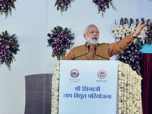 Prime Minister Narendra Modi addressing at the dedication ceremony of the Stage I of Shri Shingaji Thermal Power Project to the nation in Khandwa district in Madhya Pradesh on Thursday. PTI