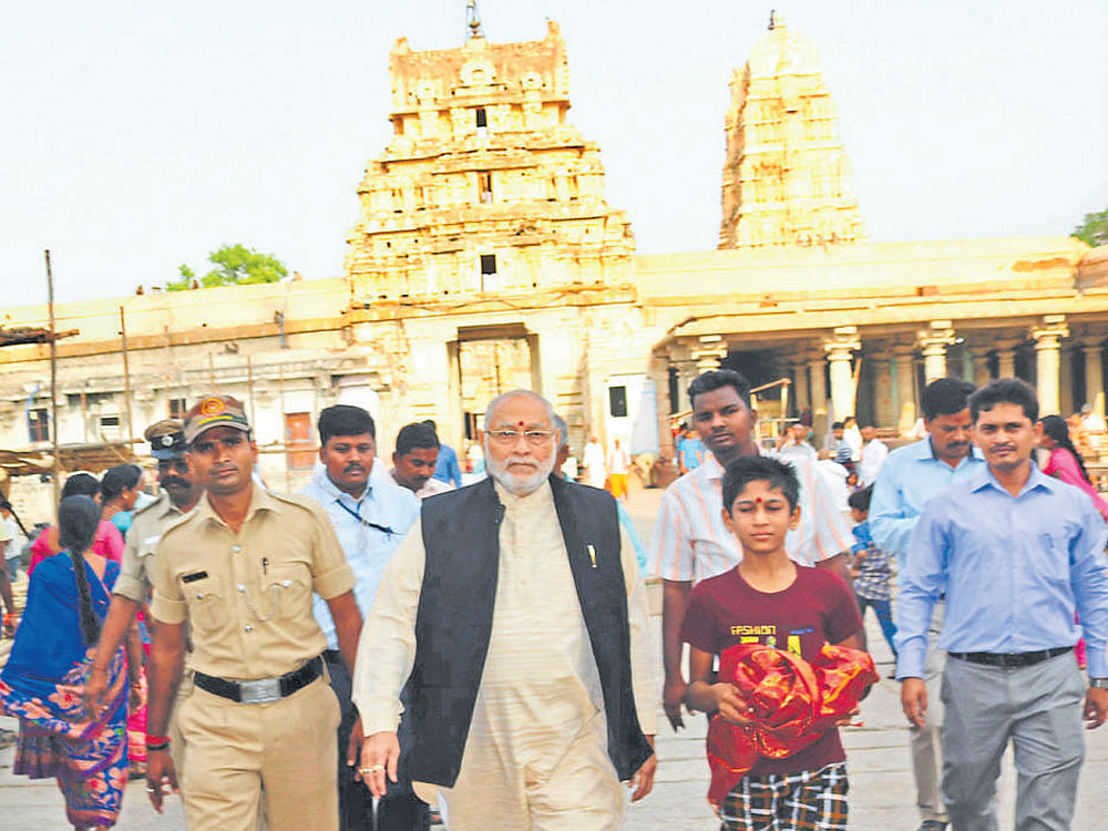 Prime Minister Narendra Modi's brother Prahladbhai Damodardas Modi comes out after visiting the Virupaksha temple at Hampi on Sunday. dh photo