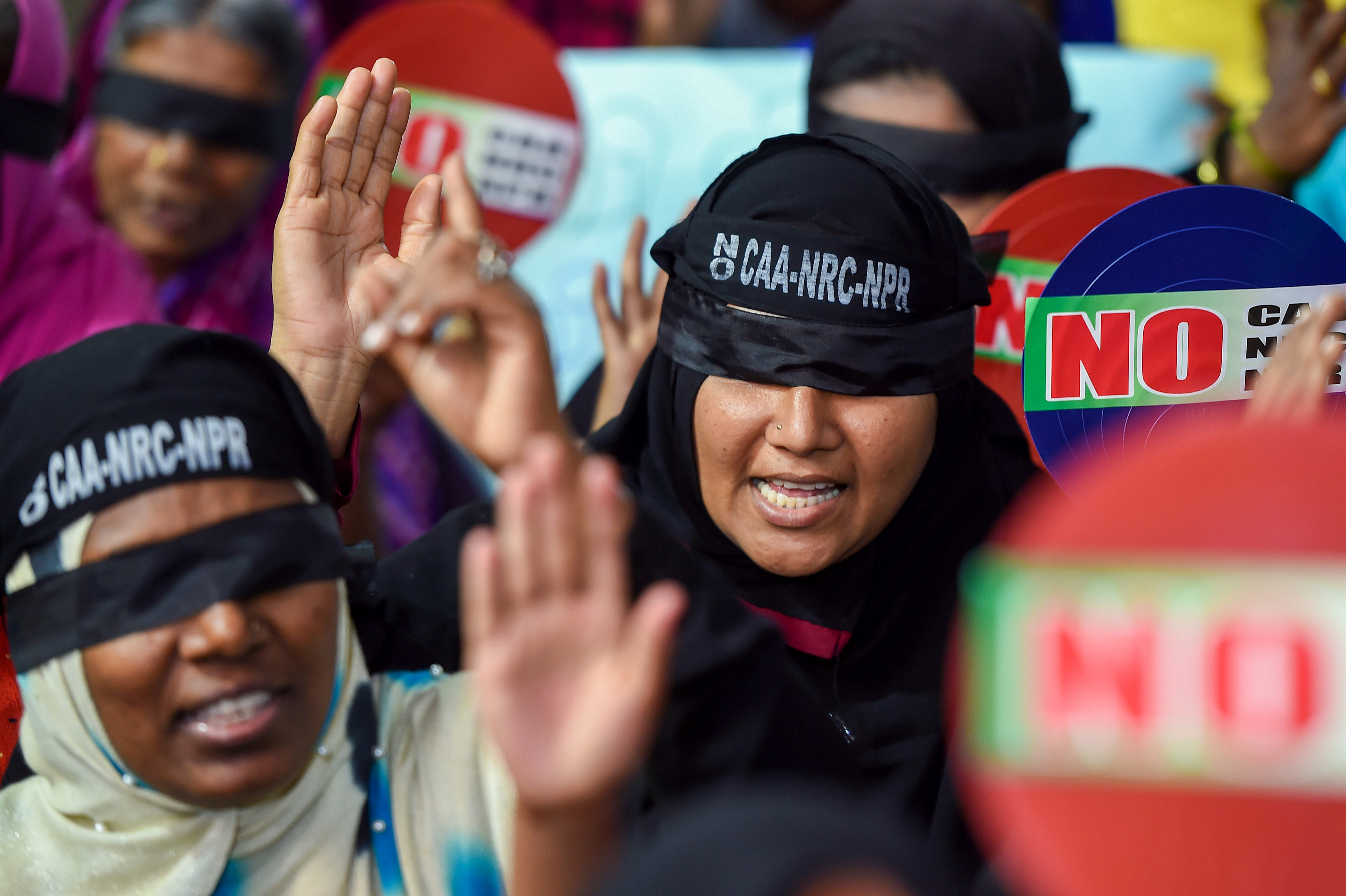 Demonstrators wear blindfolds as they raise slogans during a protest against the Citizenship Amendment Act, in Chennai. (PTI Photo)