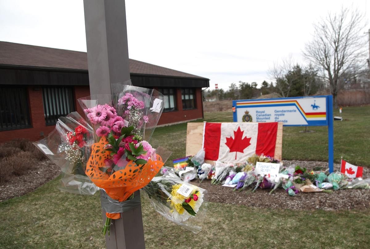 An impromptu memorial sits in front of the RCMP detachment April 20, 2020 in Enfield, Nova Scotia, Canada. AFP