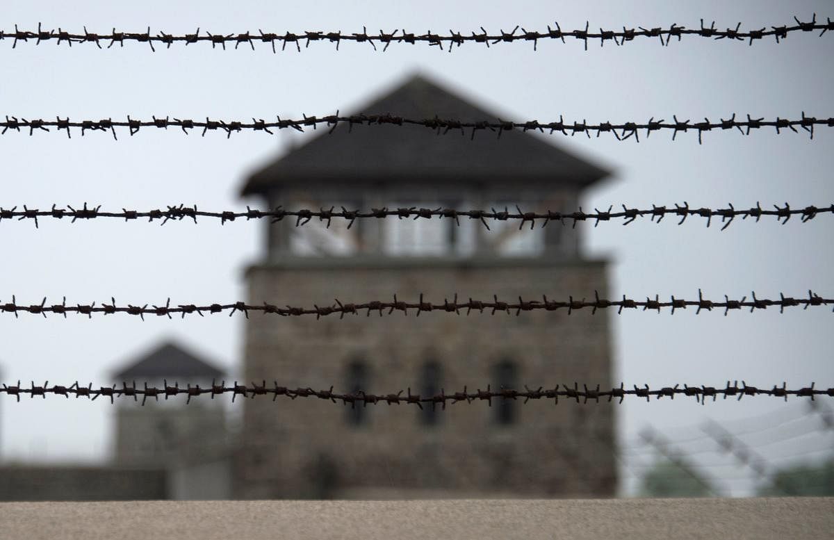 (FILES) In this file photo taken on April 28, 2015, a barbed wire fence is pictured at the former Nazi concentration camp Mauthausen, northern Austria. - German prosecutors on November 23, 2018 charged a 95-year-old man with more than 36,000 counts of acc