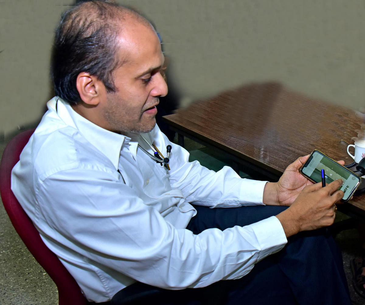 Dr Padmanabha Kamath guiding patients through his Heart Helpline. DH Photo/Govindraj Javali