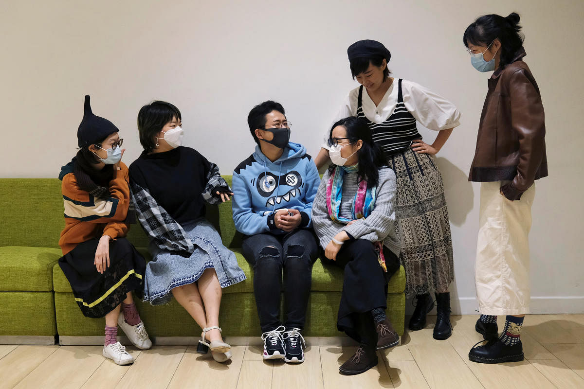 Curator Nannan (3rd-R), sociology lecturer Minnie Li (2nd-R), and four other mainland Chinese women living in Hong Kong (Reuters Photo)