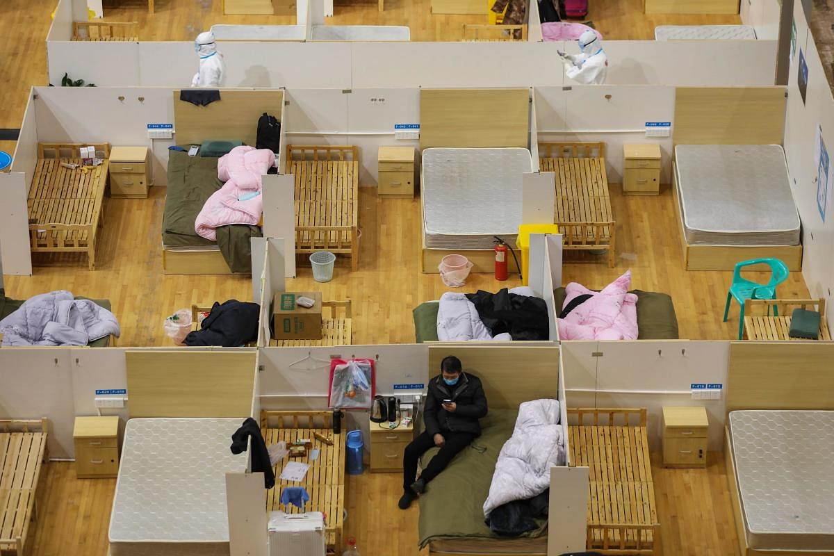  Many patients have been discharged after treatment at the temporary hospital, leaving some beds empty in China (AFP Photo)