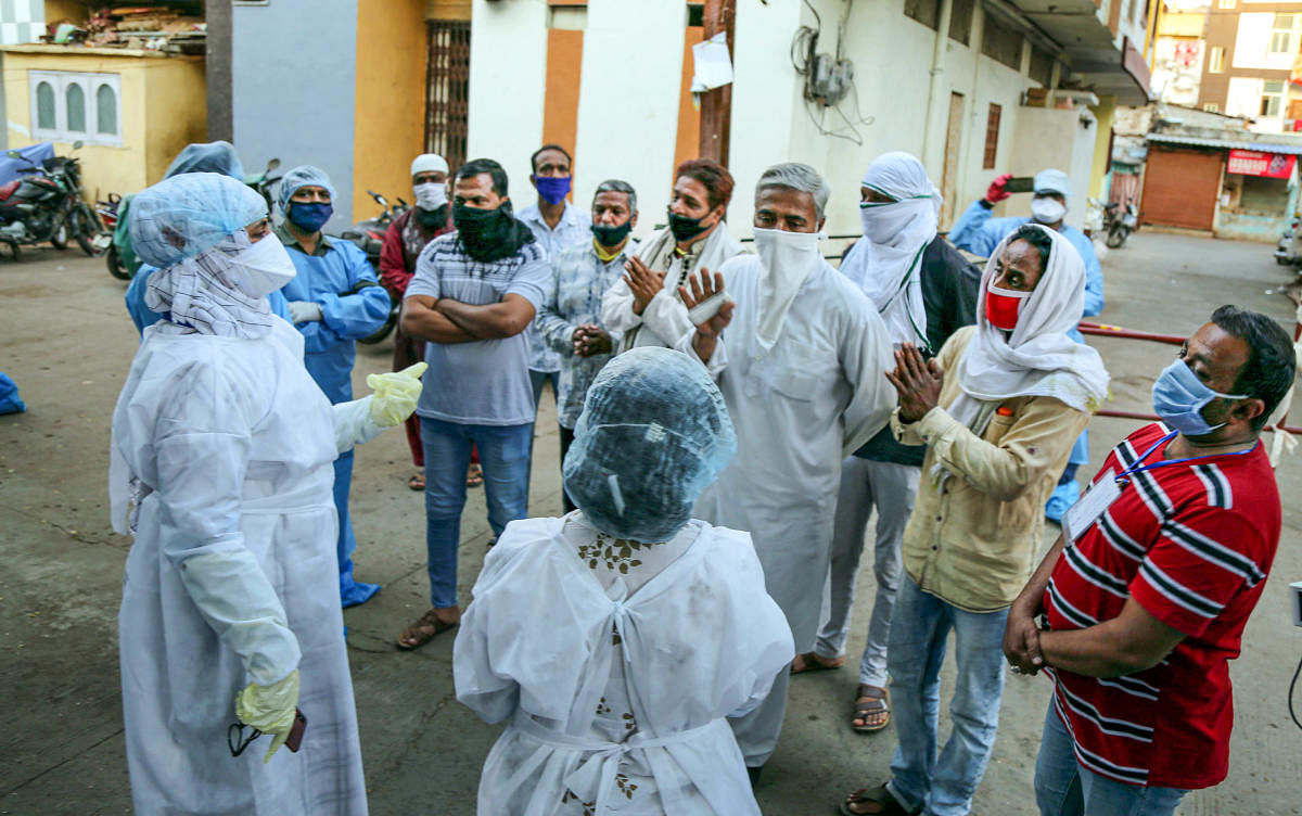 Residents of Taat Patti Bakhal apologize to a team of doctors a day after health workers were attacked by some locals who went there to screen residents in wake of COVID 19 pandemic. PTI