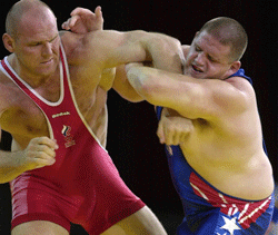 In this Sept. 27, 2000 file photo, Rulon Gardner, right, of the United States, holds the arm of Alexander Karelin of Russia during the final bout in the 130 kg class of Greco-Roman wrestling event at the Summer Olympic Games in Sydney. AP Photo for representation only
