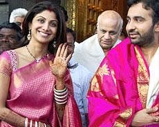 Newly wedded actress Shilpa Shetty with her husband Raj Kundra at Lord Venkateswar temple in Tirupati on Friday. PTI