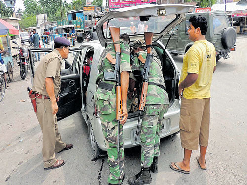 Set for final battle: Central force jawans check vehicles on the eve of the 6th and last phase of West Bengal Assembly  elections in Cooch Behar district on Wednesday. PTI