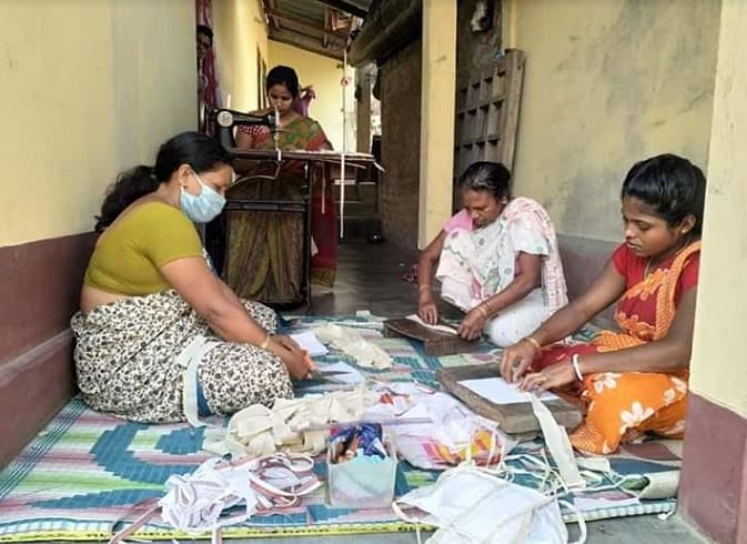 Assam women making masks under the brand name, Asomi. (Photo credit: ASRLM) 