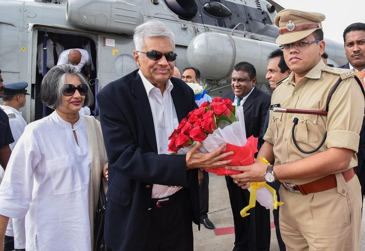 Sri Lankan Prime Minister Ranil Wickremesinghe and his wife Maithree being received on their arrival at Renigunta airport, in Tirupati on Thursday. (PTI Photo)