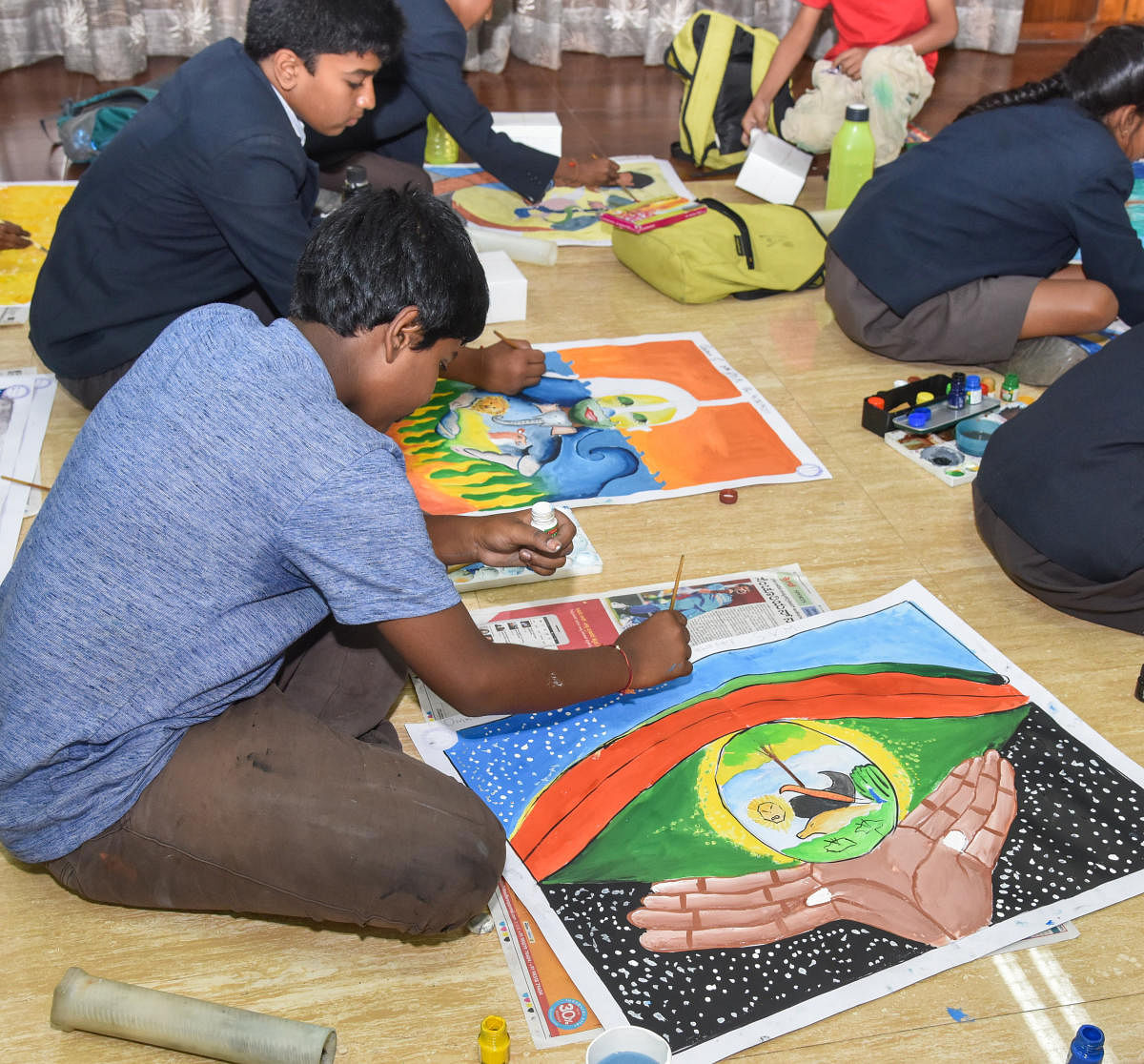 Schoolchildren take part in a drawing contest organised by the forest department on the first day of the 64th Wildlife Week in Bengaluru on Sunday. DH PHOTO/S K Dinesh