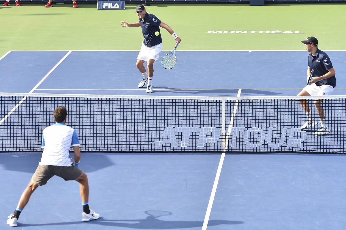 Bob Bryan and Mike Bryan of the United States compete in their doubles match against Robin Haase and Wesley Koolhof of the Netherlands during day 8 of the Rogers Cup at IGA Stadium on August 9, 2019 in Montreal, Quebec, Canada. (Minas Panagiotakis/Getty I