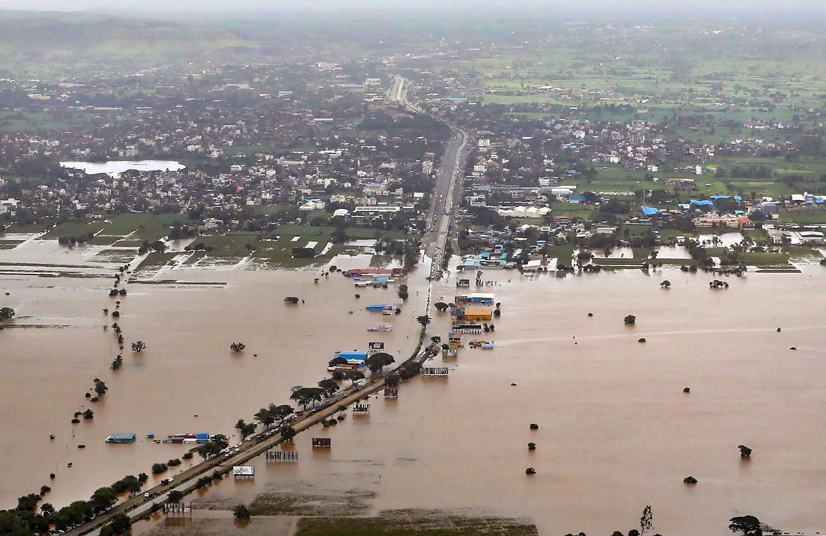 Belagavi: An aerial view of the flood affected areas in Belagavi district, Sunday, Aug 11, 2019. Union Home Minister Amit Shah along with Karnataka Chief Minister B. S. Yediyurappa conducted an aerial survey of the region. (PTI Photo) (PTI8_11_2019_000171