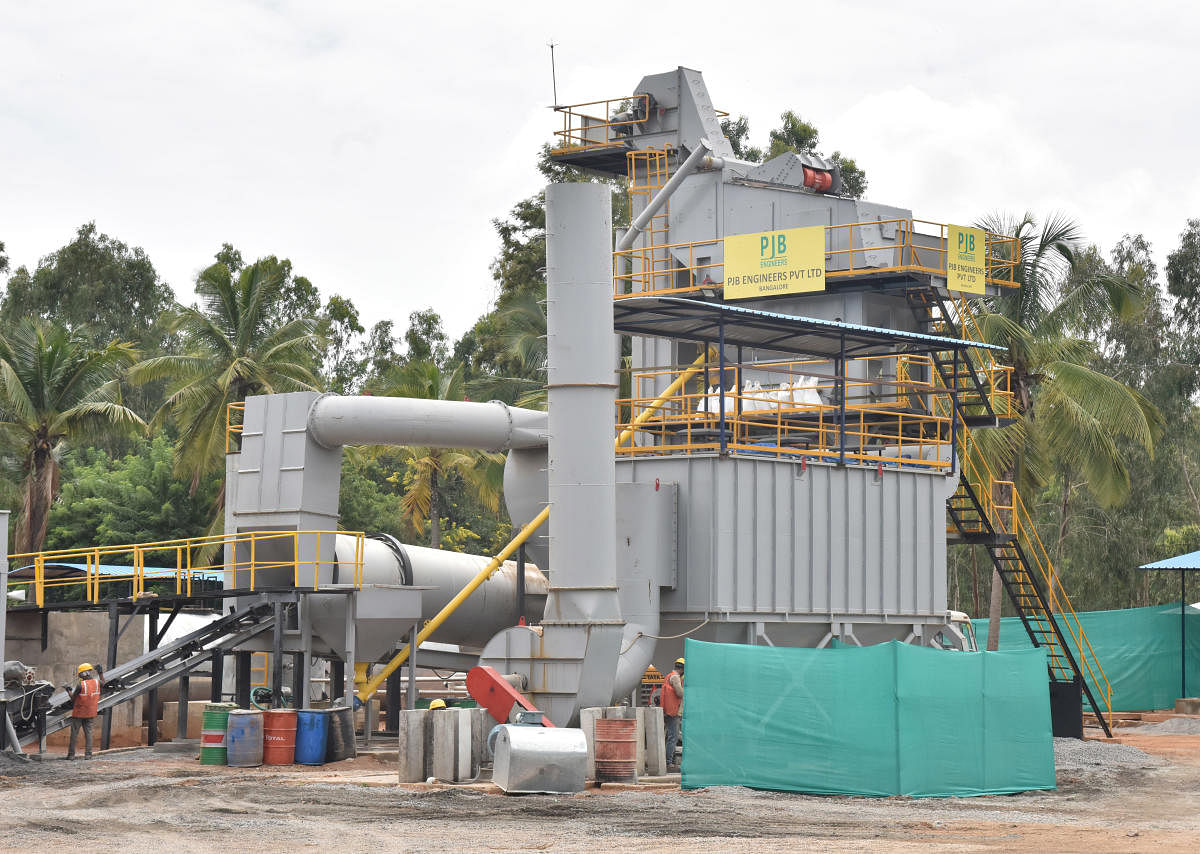 (From left to right) The plastic-bitumen mixing plant located on the Kempegowda International Airport campus; workers empty plastic into the mixer; and the roads being laid out on Thursday. DH Photos/B K Janardhan