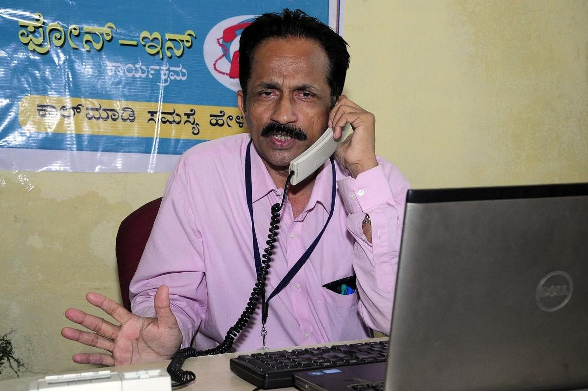 District Surgeon Dr Madhusoodan Nayak at the phone-in programme at the PV-DH office in Udupi.