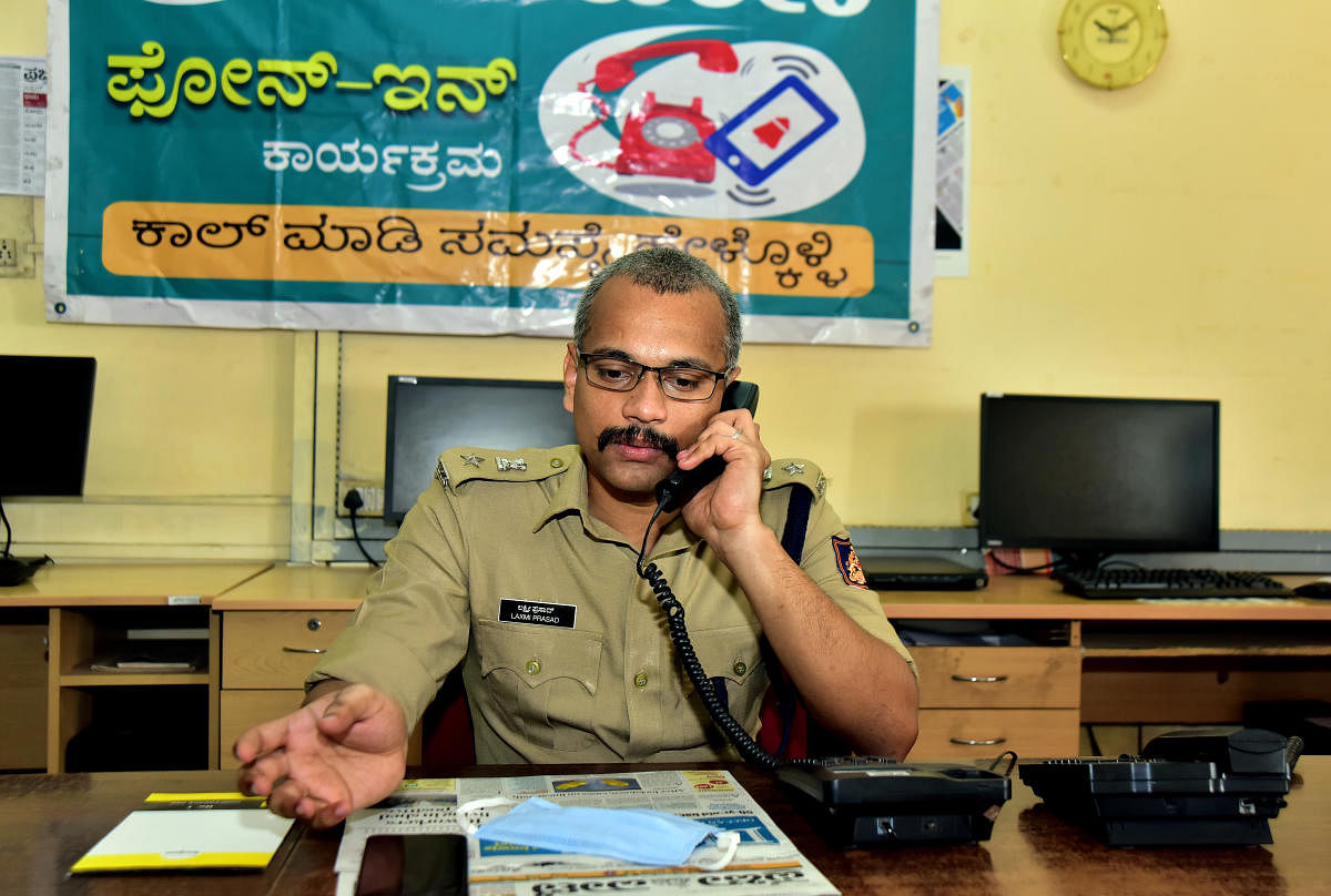 Dakshina Kannada Superintendent of Police B M Laxmi Prasad at the PV-DH phone-in programme organised at Prajavani office in Yenepoya chambers in Balmatta, Mangaluru, on Friday.