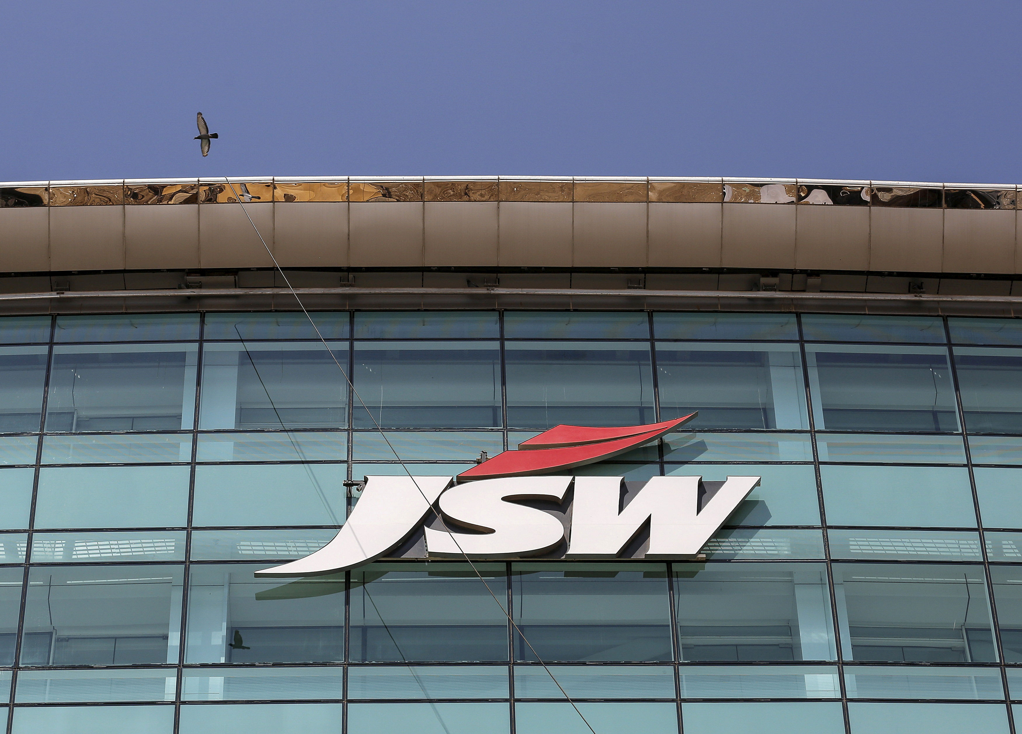 The logo of JSW is seen on the company's headquarters in Mumbai. (Credit: PTI)