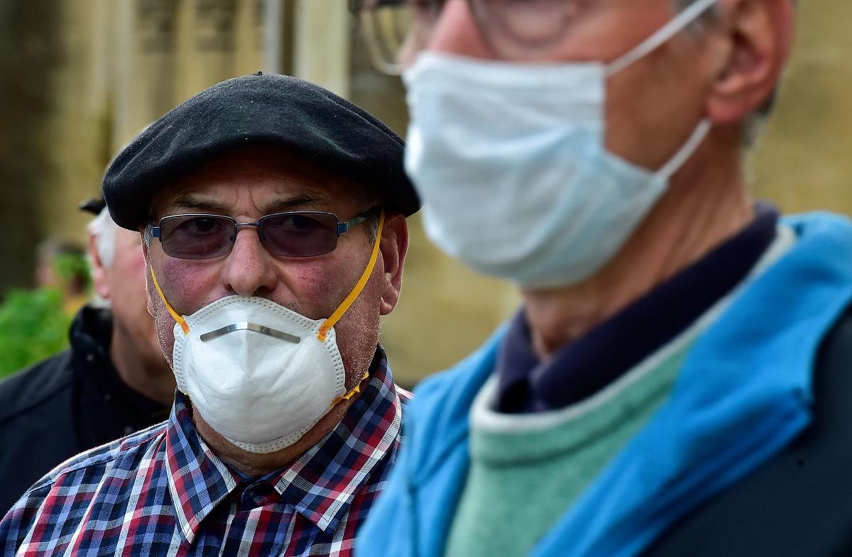 A man wearing a protective face mask (AFP Photo)