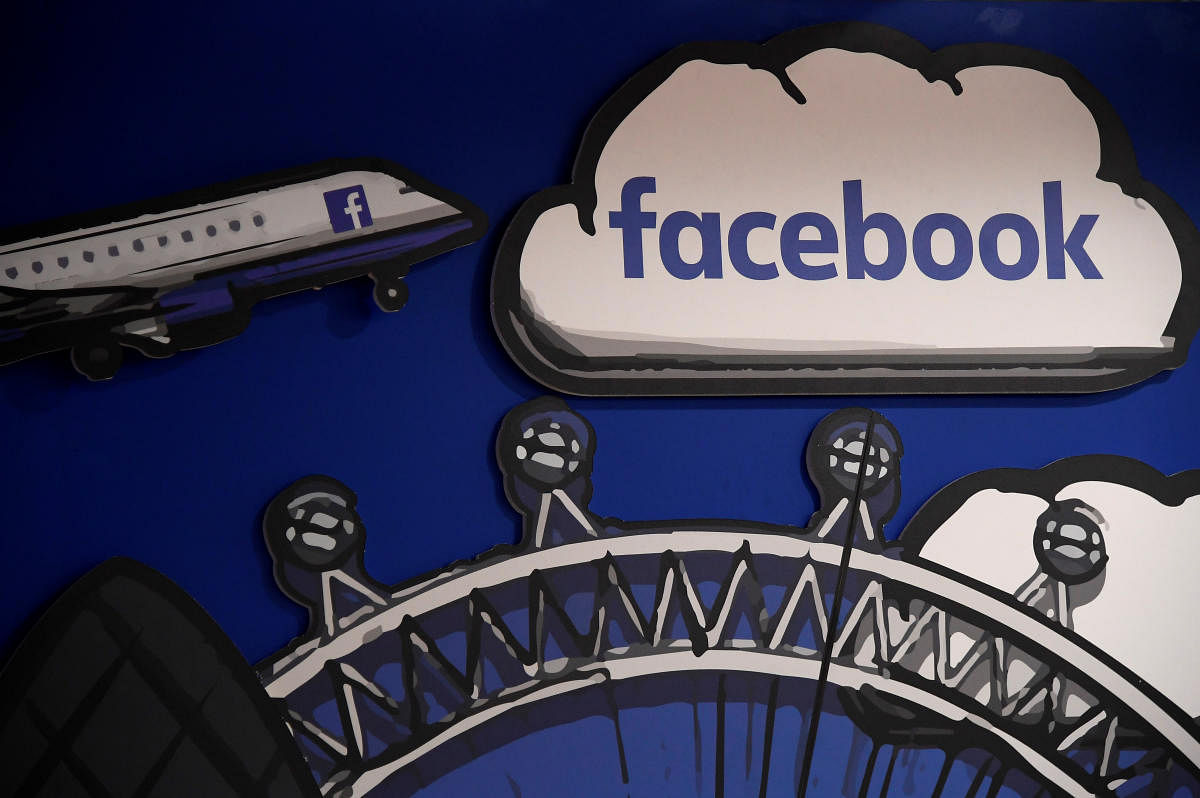 Facebook branding is seen in a workspace at the company's offices in London. (Reuters Photo)